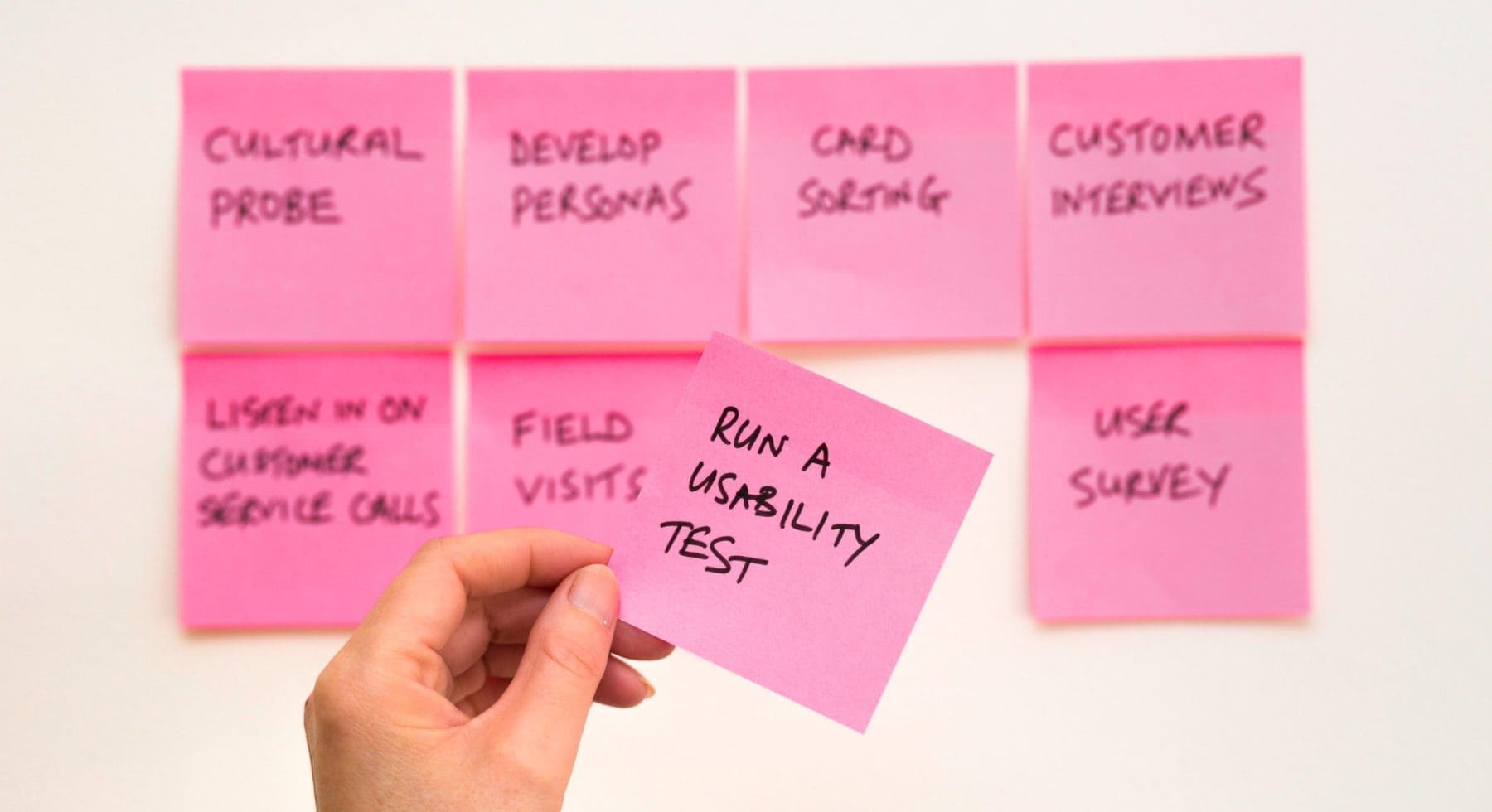 a person holding a post-it
