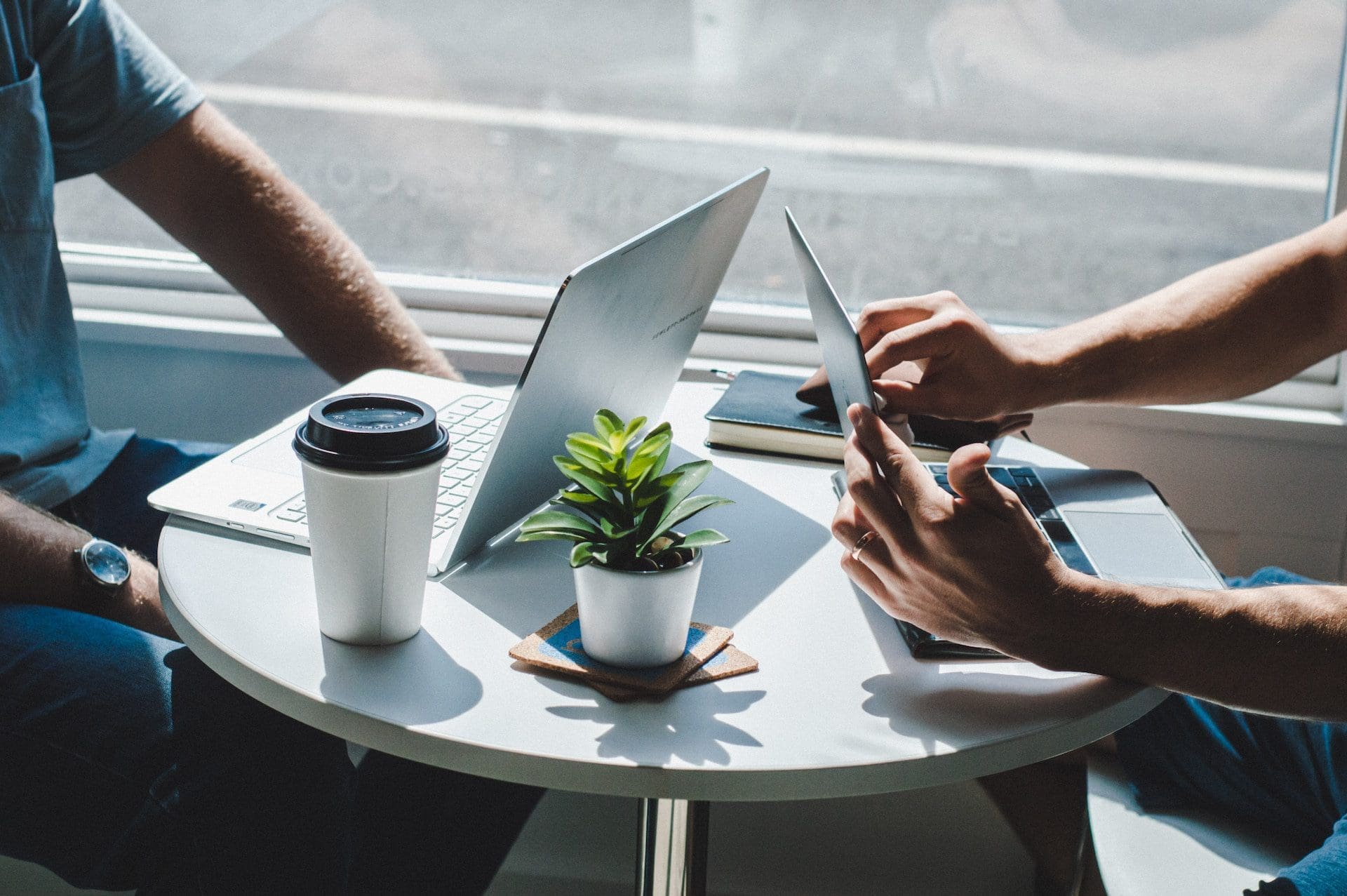 2 man with laptop taking