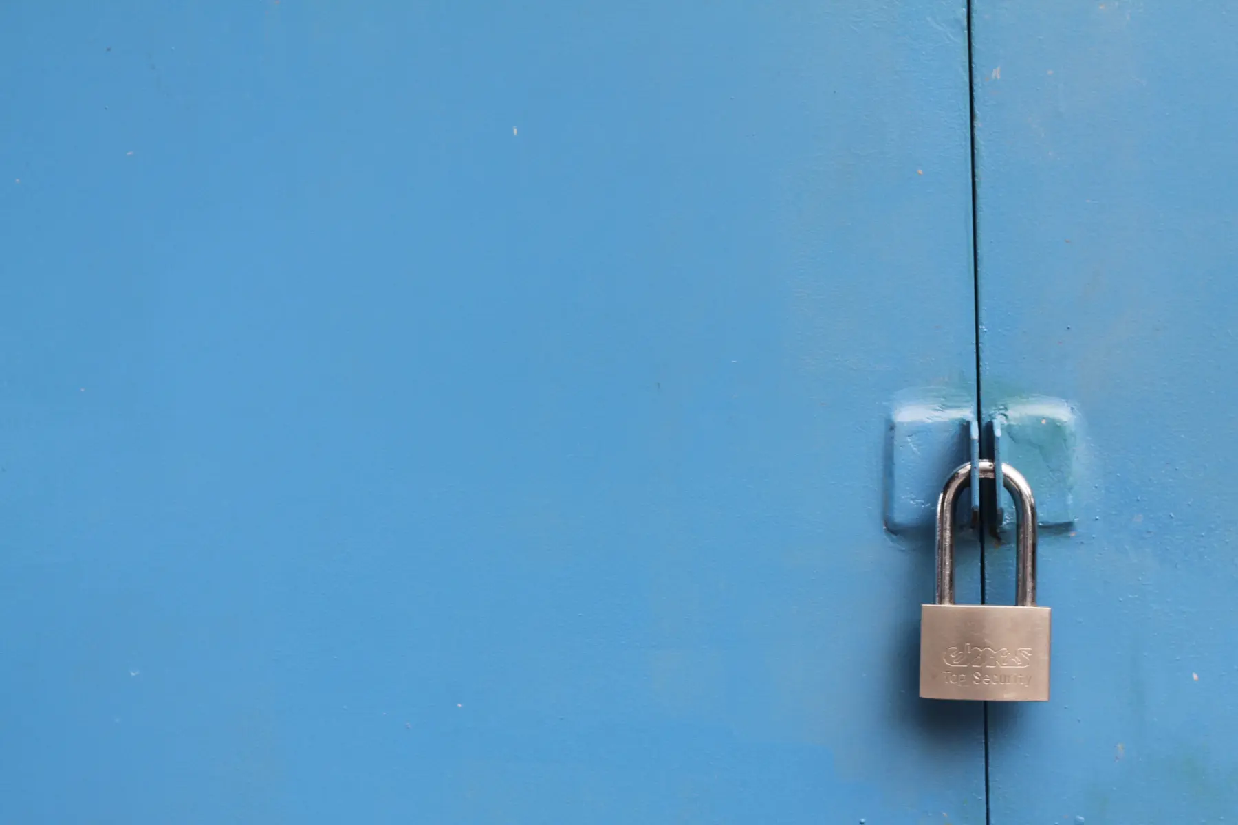 lock on blue building - wordpress security