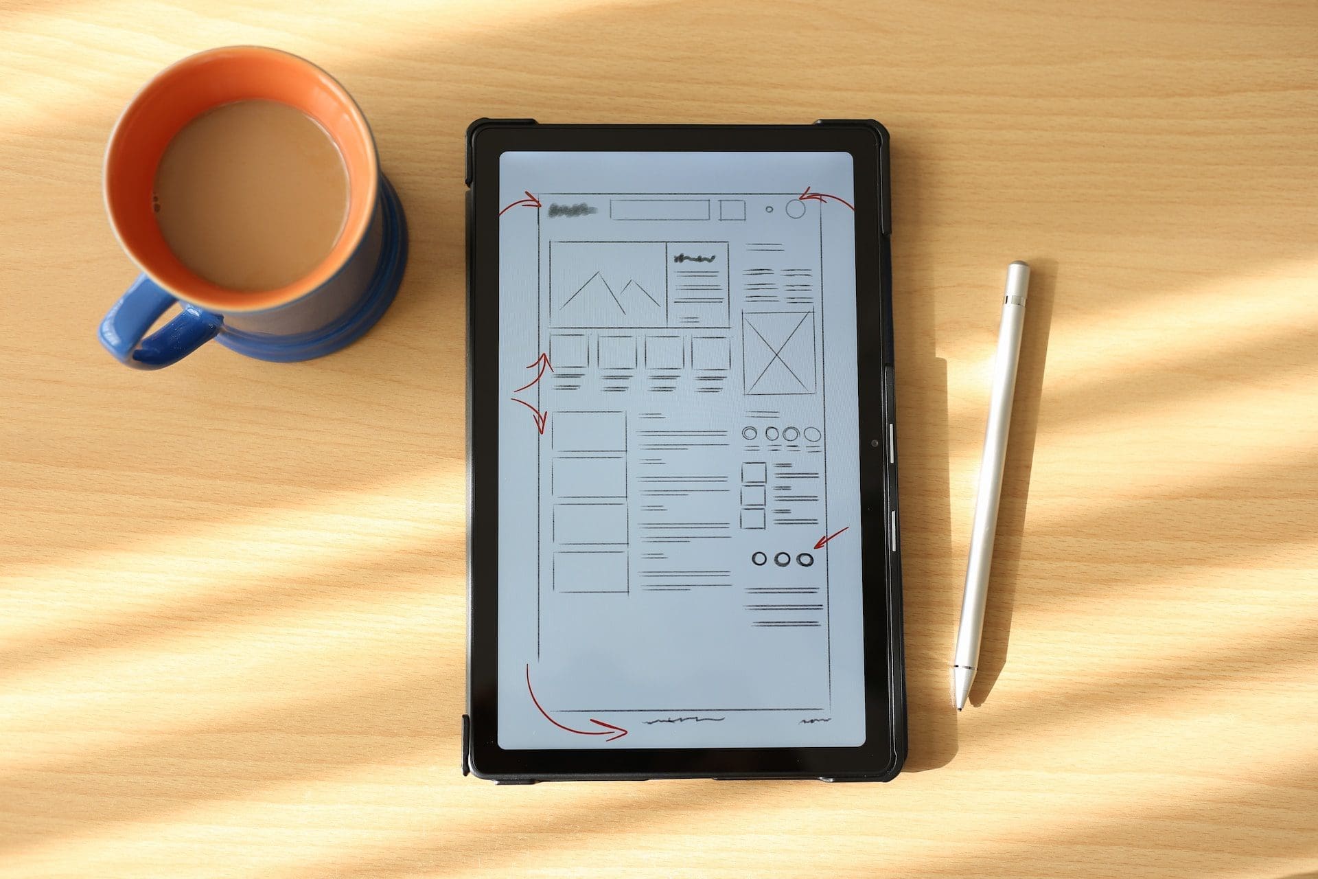tablet and coffee on top of table