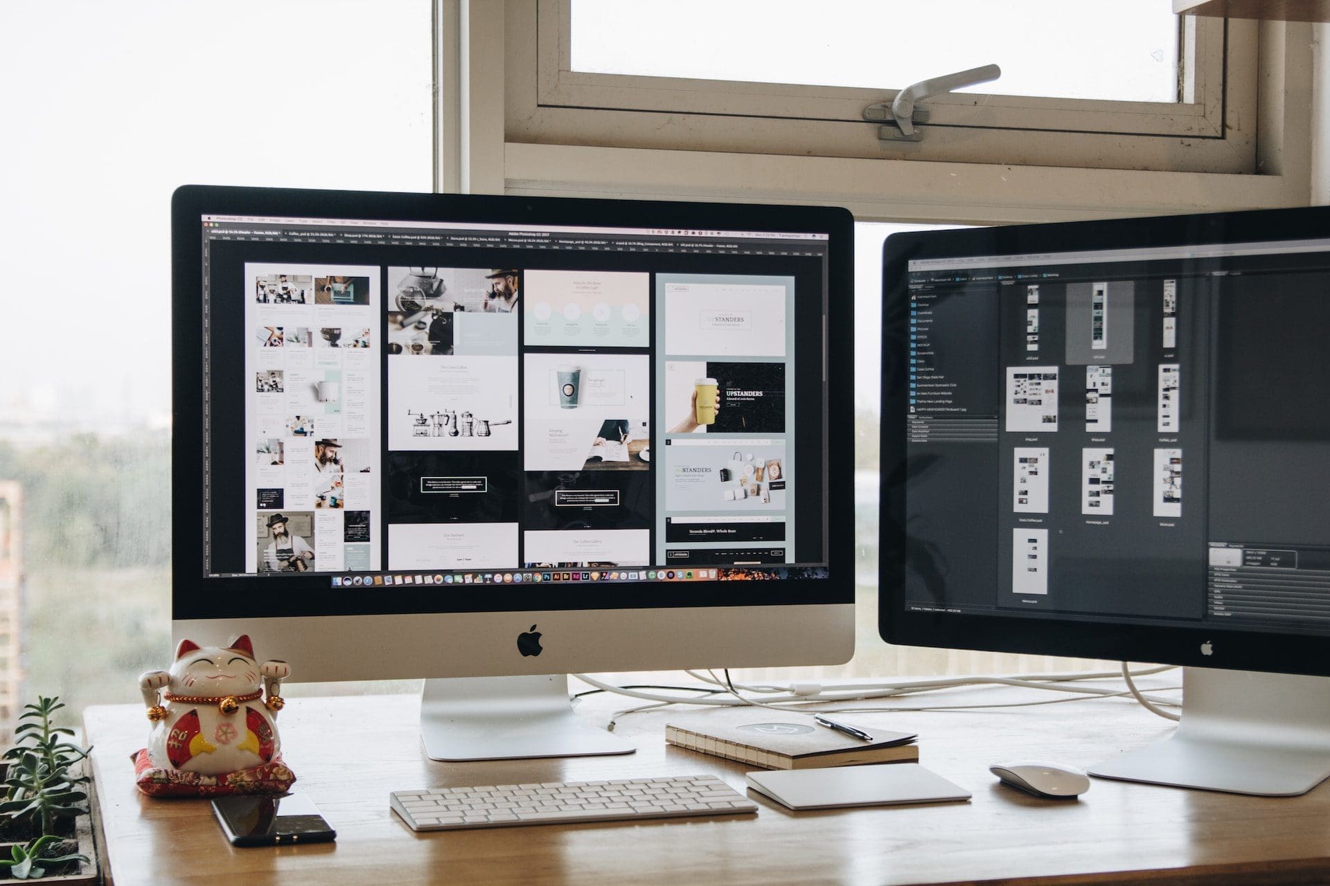 two imac on top of desk
