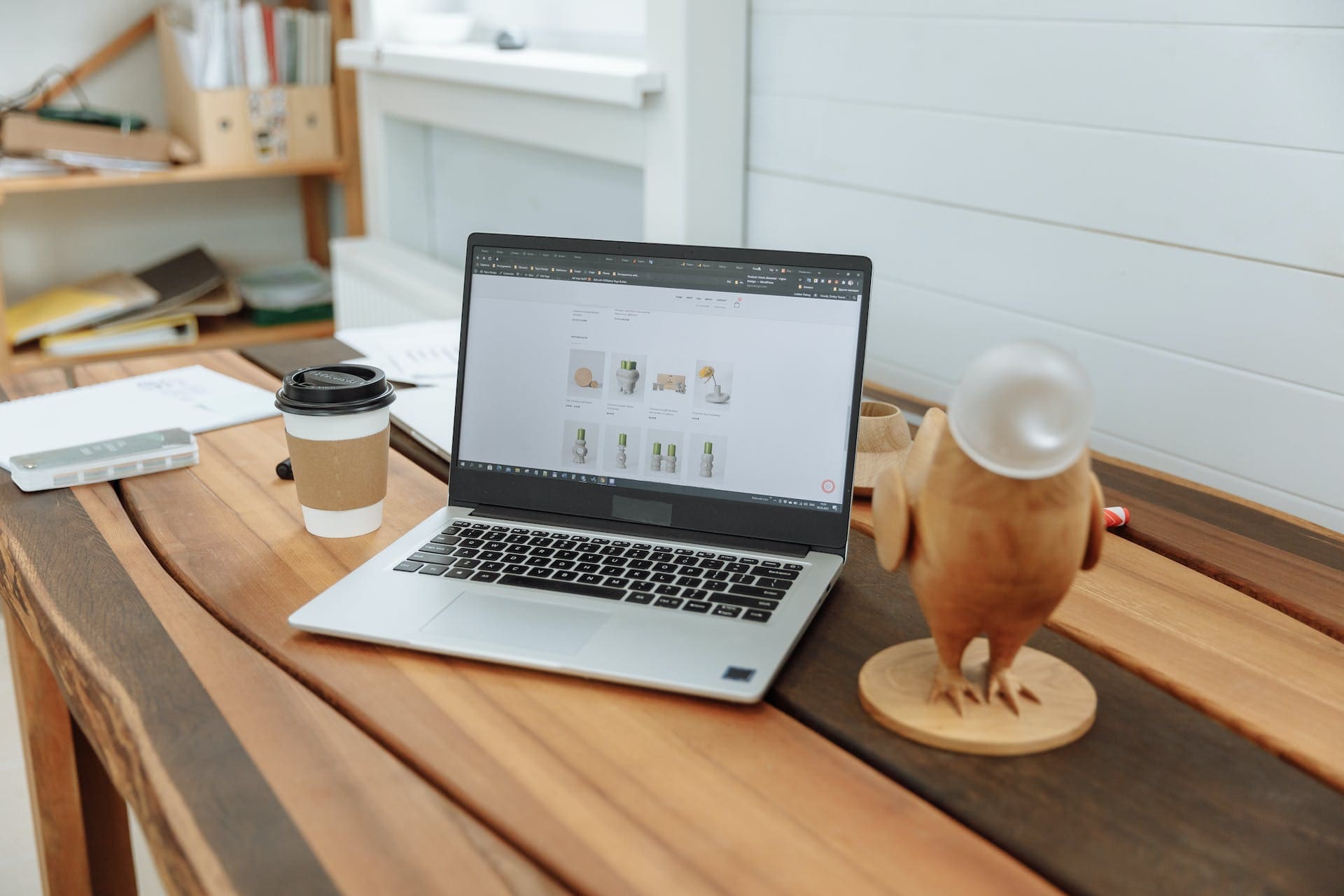 a laptop on top of wooden table